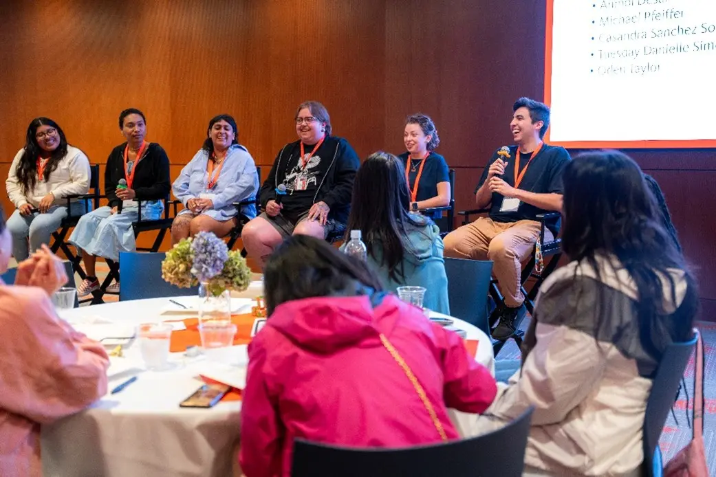 A group of people sitting in chairs