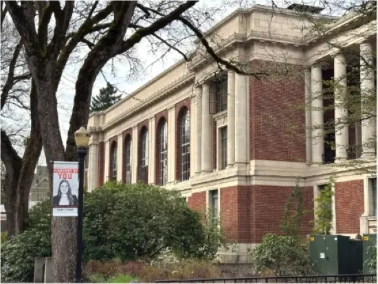 Accreditation banner hanging on a lightpost in front of OSU Corvallis Campus Memorial Union